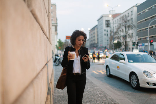 Young woman on the phone in the business district