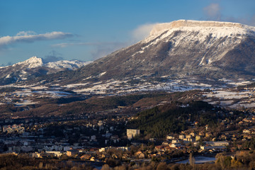 Morning winter view on the city of Gap and Ceuze mountain covered in fresh snow. Hautes-Alpes, Southern French Alps, France