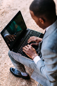 High angle view of a young man with laptop
