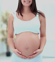 Portrait of the young pregnant woman