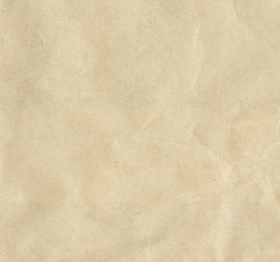 Fototapeta na wymiar Recycled light brown or beige creased paper texture background