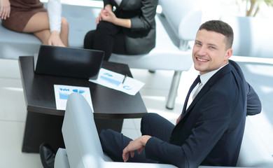 Business people working around table in modern office