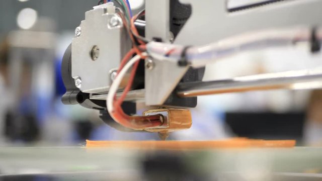 Printing with Plastic Wire Filament on 3D Printer. Close up of prototype of handcraft 3d printer. 4K Scientific research engineers working in lab with computer and 3D printer
