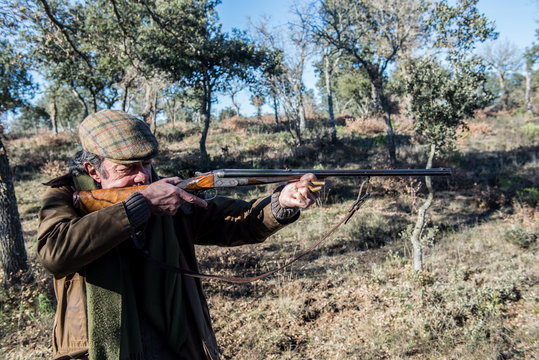 Grandpa hunting with rifle faced