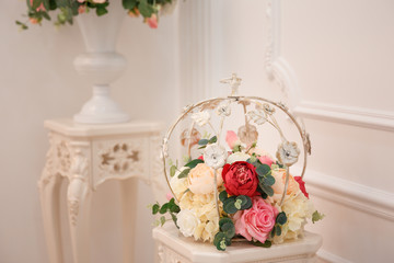 Artificial flowers. Vase with a flower arrangement in an expensive interior.