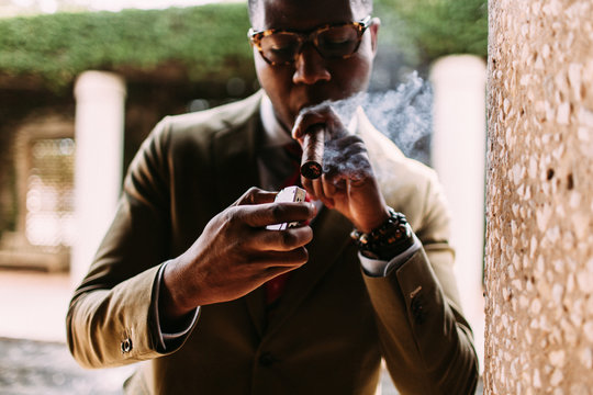 A gentleman taking a cigar break