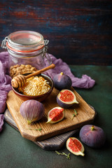 Juicy fig fruits on a dark background