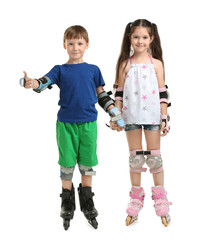 Cute children on roller skates against white background