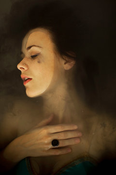 portrait of a woman lying in a black water