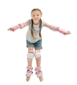 Cute girl on roller skates against white background