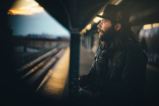 Scruffy commuter waits for the NYC subway
