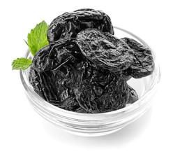 Bowl with tasty dried plums on white background