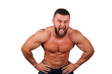 Fototapeta premium Portrait of a strong bearded male fitness model, torso. White background, isolate. hands on his hips.