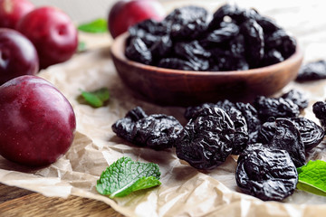 Tasty dried plums on table