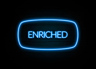 Enriched  - colorful Neon Sign on brickwall