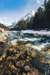 flow of mountain rocky river in kavkaz