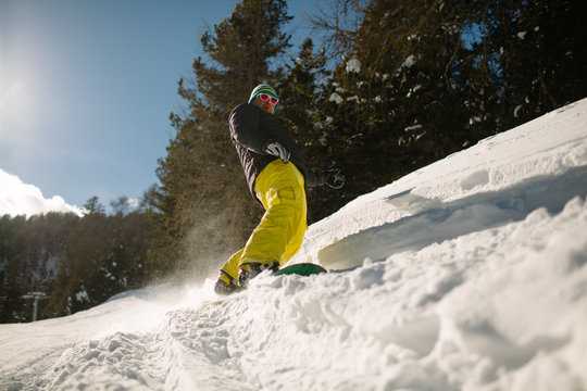 Young man snowboarding