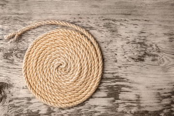 Hemp rope on wooden background