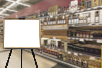 Alcohol department in the supermarket. Defocused image. Place for your text.