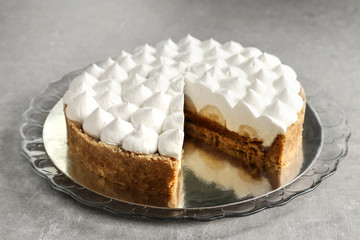 Delicious banana cake on table