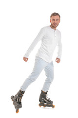 Fototapeta premium Man on roller skates against white background