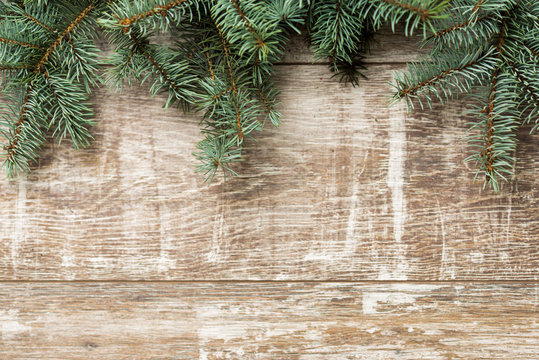 Fir tree branches and Christmas decorations are on the boards. Christmas background. Christmas Socks. New Year background. Xmax background. Christmas tree.