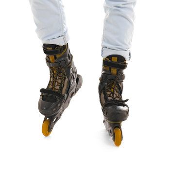 Legs of man on roller skates against white background