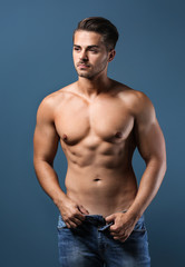 Fototapeta na wymiar Sexy shirtless man on color background