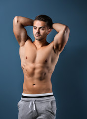 Obraz premium Sexy shirtless man on color background