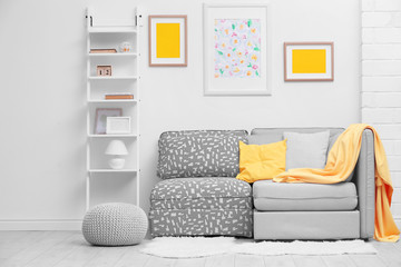 Modern interior with cozy grey sofa