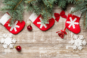 Fir tree branches and Christmas decorations are on the boards. Christmas background. Christmas Socks. New Year background. Xmax background. Christmas tree.