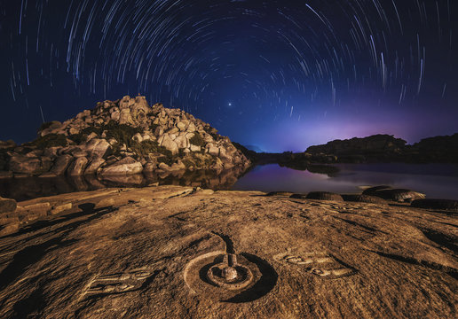 Shivalingam And startrails around The Pole Star . India. Hampi