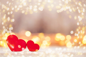 Red hearts on the wooden background.