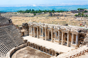 Fototapeta na wymiar Ancient Amphitheater in the ancient city of Hierapolis. Summer. Pamukkale, Turkey. 