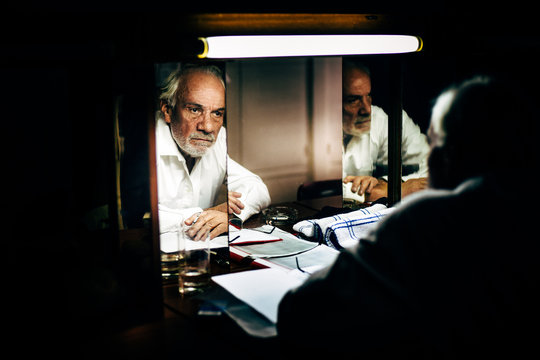 Portrait Of Old Man Preparing For Stage Performance