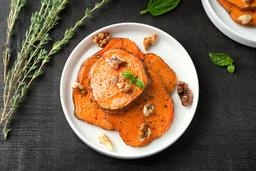 Plate with cooked sweet potato on table