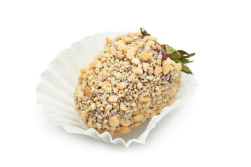 Tasty chocolate dipped strawberry covered with nuts, on white  background