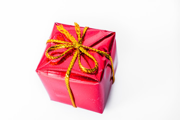 Close up of red xmas gift. Christmas and New Year concept with copy space. Christmas greeting card.