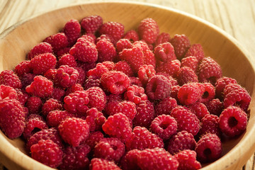 raspberries in a plate,in wooden bowl,basket/bush branch/growing raspberries,raspberries background closeup photo,high resolution product,Delicious first class organic fruit,Raspberry as background
