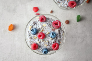 Glass dessert bowl with delicious chia seed pudding on table