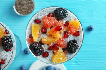 Glass with delicious chia seed pudding on table, close up