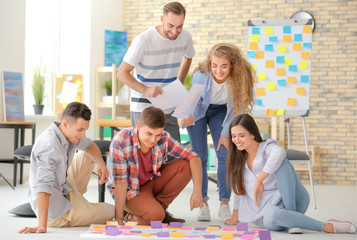 Team of young business professionals having meeting in office