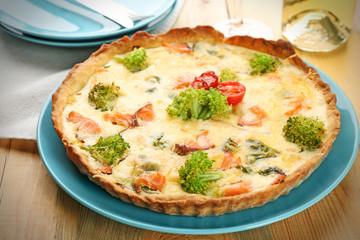Tasty salmon quiche on plate