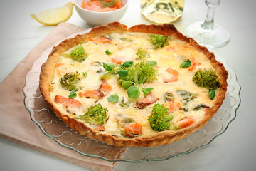 Tasty salmon quiche on plate