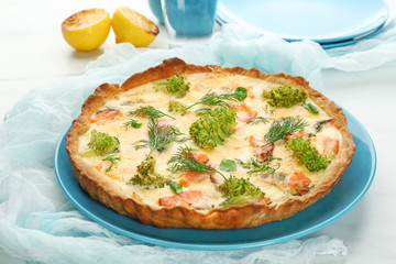 Tasty salmon quiche on plate