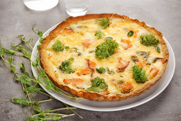 Tasty salmon quiche on plate