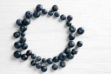 Fresh acai berries on wooden background