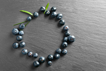 Fresh acai berries on dark background