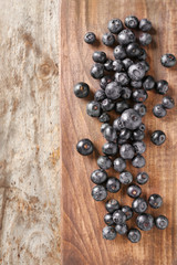 Fresh acai berries on wooden background