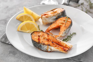 Grilled salmon steaks on plate